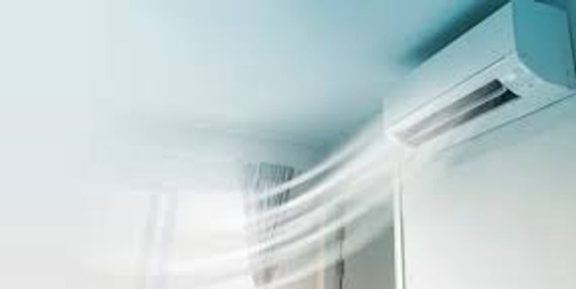 Wall-mounted heat pump indoor unit in a modern home